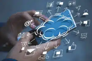 hand holding a mobile with a cloud symbol on top leading to all the different functions which could be performed