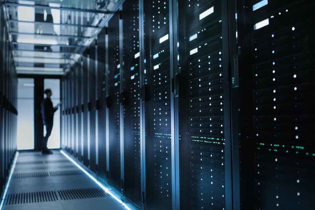 Man in server room performing technical IT support