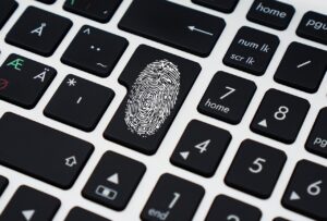 finger print on a key on a computer keyboard