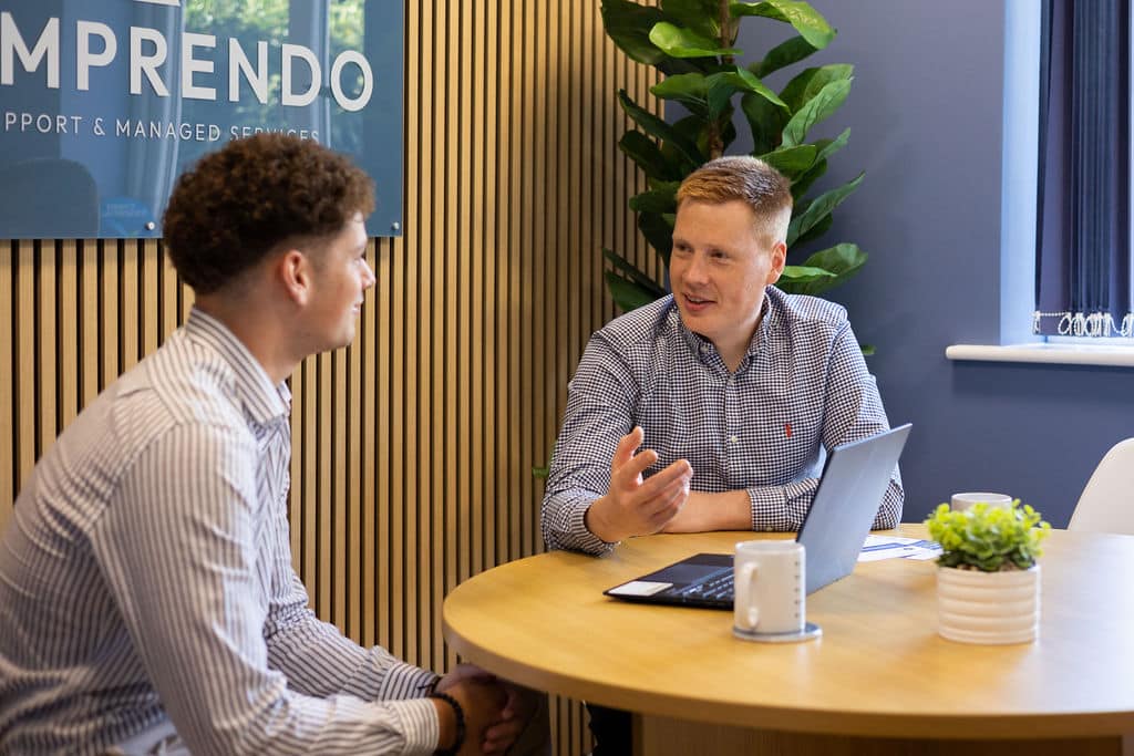 1 client and 1 IT managed service provider sat at a table in the Comprendo office discussing IT strategy